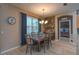 Light and bright dining room showcases a chandelier and view to an adjacent bedroom space at 269 Englenook Dr, Debary, FL 32713