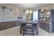 The cozy dining room with natural light, an elegant chandelier, and a stylish hutch at 269 Englenook Dr, Debary, FL 32713