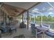 Spacious enclosed patio with ample seating and an outdoor ceiling fan at 269 Englenook Dr, Debary, FL 32713