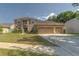 Charming two-story home with a manicured front lawn and a spacious three-car garage at 269 Englenook Dr, Debary, FL 32713
