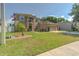 Well-maintained two-story home with a lush green lawn and mature landscaping at 269 Englenook Dr, Debary, FL 32713
