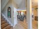 The foyer leads to the open-concept living area, showcasing the hardwood floors and stylish design at 269 Englenook Dr, Debary, FL 32713
