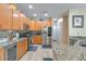 Bright eat-in kitchen with stainless steel appliances and granite countertops is ideal for entertaining at 269 Englenook Dr, Debary, FL 32713