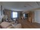 Cozy living room features hardwood floors, natural light, and comfortable seating at 269 Englenook Dr, Debary, FL 32713