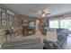 Inviting living room with stylish wood accent wall, cozy seating, and plenty of natural light at 269 Englenook Dr, Debary, FL 32713