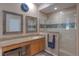 Bathroom features dual sinks, vanity area, and walk-in shower with tile surround at 269 Englenook Dr, Debary, FL 32713