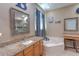 Main bathroom with dual vanities, soaking tub, separate makeup vanity and glass enclosed shower at 269 Englenook Dr, Debary, FL 32713