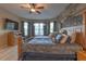 Bedroom with decorative wall, ceiling fan, and bay window provides a relaxing retreat at 269 Englenook Dr, Debary, FL 32713