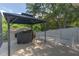 Outdoor patio with a gazebo, BBQ grill, and lush backyard at 269 Englenook Dr, Debary, FL 32713