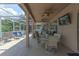 Relaxing screened patio area with ceiling fans and outdoor seating, perfect for entertaining at 269 Englenook Dr, Debary, FL 32713