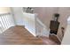 Staircase featuring wood stairs and white railings at 269 Englenook Dr, Debary, FL 32713