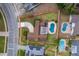 Aerial view of property with pool, patio, driveway, and well-maintained lawn outlined in red at 275 Tollgate Trl, Longwood, FL 32750