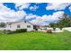 Large backyard featuring a pool and patio area, green lawn, and white fence at 275 Tollgate Trl, Longwood, FL 32750