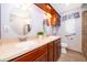 Bathroom featuring double sinks, vanity with granite countertop, and well-lit mirrors at 275 Tollgate Trl, Longwood, FL 32750
