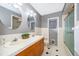 Updated bathroom boasts double sinks, modern fixtures, and shower at 275 Tollgate Trl, Longwood, FL 32750