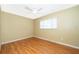 Bright bedroom with laminate flooring, ceiling fan, and a large window providing natural light at 275 Tollgate Trl, Longwood, FL 32750