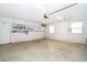 Clean and functional garage space with storage shelves and natural light at 275 Tollgate Trl, Longwood, FL 32750