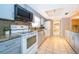 Well-lit kitchen showcases modern appliances, granite countertops, and ample cabinet space at 275 Tollgate Trl, Longwood, FL 32750