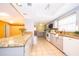 Modern kitchen with light gray cabinetry, granite countertops, tile flooring, and stainless steel appliances offering ample space at 275 Tollgate Trl, Longwood, FL 32750