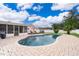 Swimming pool with brick patio surrounded by a lush green lawn and deck at 275 Tollgate Trl, Longwood, FL 32750