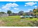 Wide-open backyard featuring a swimming pool, lush grass, and storage shed at 2811 Citron Dr, Longwood, FL 32779