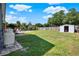Vast backyard with plenty of room, a storage shed, and a glimpse of a swimming pool at 2811 Citron Dr, Longwood, FL 32779
