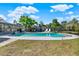 Lush backyard featuring a sparkling swimming pool, a screened in porch, and ample green space for outdoor activities at 2811 Citron Dr, Longwood, FL 32779
