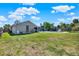 Enormous backyard with lush grass, ample space, and a partial view of the swimming pool at 2811 Citron Dr, Longwood, FL 32779