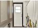 Bathroom featuring modern cabinet, a decorative shower curtain, and a back door at 2811 Citron Dr, Longwood, FL 32779