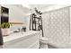 Close up of bathroom features a modern sink, decorative ladder, and a patterned shower curtain at 2811 Citron Dr, Longwood, FL 32779