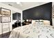Modern bedroom features a comfortable bed, dark accent wall, and ample closet space at 2811 Citron Dr, Longwood, FL 32779