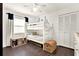 Comfortable ' bedroom featuring a bunk bed, hardwood floors, and ample storage space at 2811 Citron Dr, Longwood, FL 32779