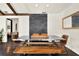 Modern dining room boasting stylish table and chairs, with brick accent wall and wood-look flooring at 2811 Citron Dr, Longwood, FL 32779