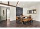 Modern dining room boasting stylish table and chairs, brick accent wall, and wood-look flooring at 2811 Citron Dr, Longwood, FL 32779