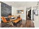 Dining room with sleek table and chairs, flows into an open floor plan with stainless steel appliances at 2811 Citron Dr, Longwood, FL 32779