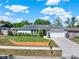 Well-maintained single Gathering home featuring manicured landscaping, lengthy drive, and an attached two-car garage at 2811 Citron Dr, Longwood, FL 32779