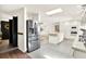Open-concept kitchen with stainless steel appliances, island, and view into the living area at 2811 Citron Dr, Longwood, FL 32779