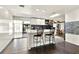 Bright kitchen with modern white cabinets, island, breakfast bar, and stainless steel appliances at 2811 Citron Dr, Longwood, FL 32779