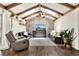 Bright living room with vaulted ceilings, skylights, ceiling fan, and unique decorative brick wall at 2811 Citron Dr, Longwood, FL 32779