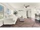 Bright living room showcasing comfortable white seating, stylish rug, natural light, and open-concept layout at 2811 Citron Dr, Longwood, FL 32779