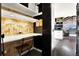Stylish office nook features a built-in desk, decorative wallpaper, and ample shelving for organization at 2811 Citron Dr, Longwood, FL 32779