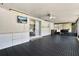Enclosed patio boasts floor-to-ceiling windows, TV and outdoor kitchen area at 2811 Citron Dr, Longwood, FL 32779