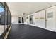 Enclosed patio with floor-to-ceiling windows, ceiling fan, and access door at 2811 Citron Dr, Longwood, FL 32779