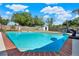 Sparkling backyard pool with brick trim, basketball hoop and lush greenery, perfect for summer fun and relaxation at 2811 Citron Dr, Longwood, FL 32779