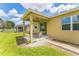 A cozy back patio with neutral colors, offering a great place to unwind and enjoy the outdoors at 2815 Shelburne Way, St Cloud, FL 34772