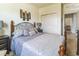 Comfortable bedroom with decorative headboard, and ample closet space at 2815 Shelburne Way, St Cloud, FL 34772