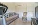 Comfortable bedroom with a sofa, chair, and ample closet space, ideal for relaxation and storage at 2815 Shelburne Way, St Cloud, FL 34772