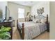 Cozy bedroom with neutral decor and plush carpeting, featuring lots of natural light at 2815 Shelburne Way, St Cloud, FL 34772
