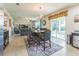 Open dining area with neutral decor and bar seating visible to the kitchen and living area at 2815 Shelburne Way, St Cloud, FL 34772