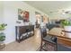 Stylish dining area with dark wood furniture, breakfast bar, and an open view to the living space at 2815 Shelburne Way, St Cloud, FL 34772